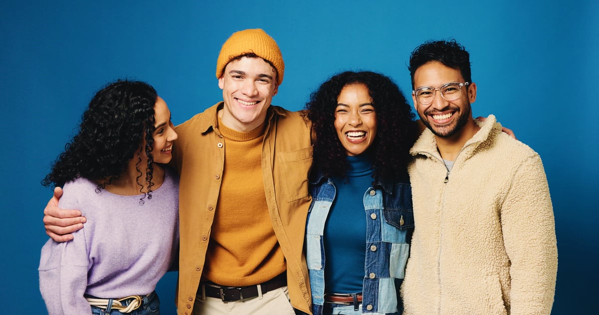 Diverse group of young people celebrating together, feeling empowered and confident